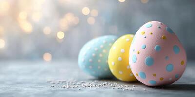 Colorful decorative eggs arranged on a textured surface with bokeh lighting in the background during spring celebration photo