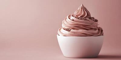 Creamy chocolate dessert served in a white bowl against a soft pink background photo