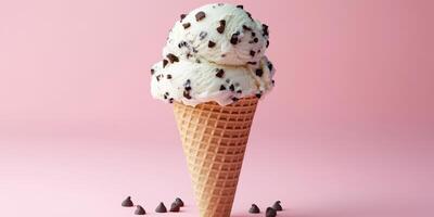 Chocolate chip ice cream cone with sprinkles on a pink background in a summer-themed display photo