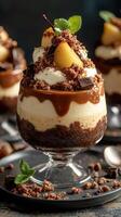 Delicious layered dessert featuring chocolate, cream, and fruit in a clear glass bowl photo