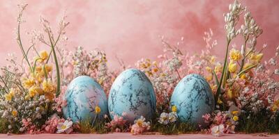 Colorful decorative eggs arranged among delicate spring flowers in a lovely floral display photo