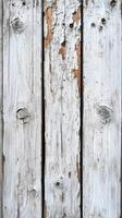 Weathered wooden planks with peeling white paint show signs of age and wear in natural light photo
