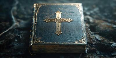 Decorative leather-bound book with a cross resting on a textured surface photo