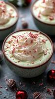 Festive mint dessert topped with whipped cream and crushed candy canes in cozy setting photo