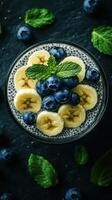 Delicious chia seed pudding topped with banana slices and fresh blueberries for a nutritious breakfast photo