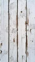 Weathered white wooden planks showcase texture and character in a rustic setting photo