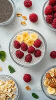 Delicious chia pudding topped with fresh raspberries and bananas on a light textured surface photo