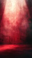 Red textured background with dramatic lighting creating an artistic atmosphere in a studio setting photo