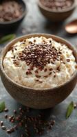 Delicious bowl of creamy yogurt topped with crunchy flax seeds on a rustic kitchen table photo