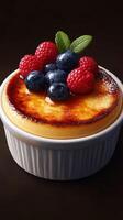 Luxurious dessert topped with berries served in a round dish on a dark background photo