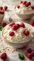 Creamy dessert topped with fresh raspberries and oats in a cozy kitchen setting during a sunny afternoon photo