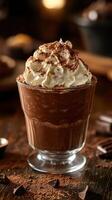 Delicious chocolate dessert topped with whipped cream and cocoa on a rustic wooden table photo
