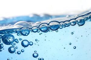 Natural texture of water with ripples on the surface. Transparent colored clear calm water surface texture with splashes and bubbles. Water waves with shining pattern texture background. photo