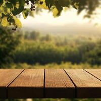 Wooden table with view of vineyard and trees photo