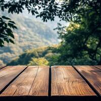 An empty wooden table in front of a forest photo