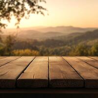 An empty wooden table with a view of the mountains photo