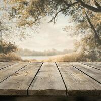 Wooden table with trees and lake in background photo