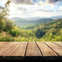 Empty wooden table with mountain view photo
