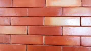 Abstract background of exposed red bricks with close up. photo