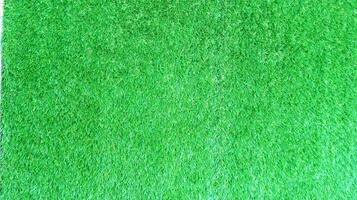 Abstract background of synthetic grass with close up. photo