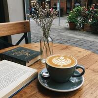 Coffee and book on a table photo