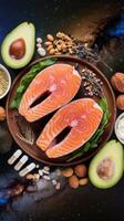 Salmon, avocado, nuts and seeds on a plate photo