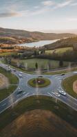 An aerial view of a roundabout with a lake in the background photo