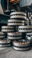 A pile of metal bearings sitting on top of a machine photo
