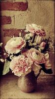A vase with pink flowers in it photo