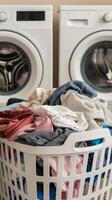 A basket full of clothes in front of a washing machine photo