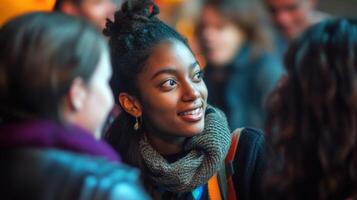 Young filmmaker smiling and networking during a film festival photo