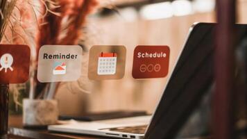 A closeup view of holographic icons and notifications hovering above a desk displaying reminders and schedules with a laptop in the backdrop highlighting the integration of. photo