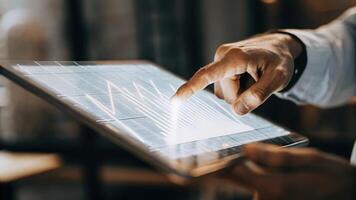 A closeup shot of a hand using a holographic touchpad manipulating 3D data visualizations that float above the surface showcasing interactive analysis.. photo