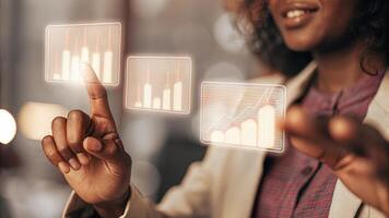 A closeup of an individual gesturing toward floating digital graphs displaying performance metrics their focused expression highlighting the significance of the data being. photo