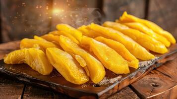 Slices of ripe mango arranged on a wooden platter, showcasing their vibrant color and texture. photo