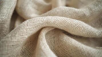 Close-up of textured beige fabric, showcasing its weave and softness. photo