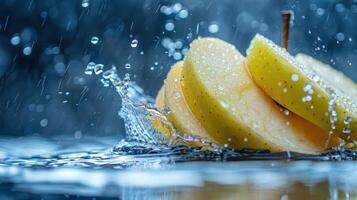 Sliced yellow apples create splashes in water, showcasing freshness and vitality. photo