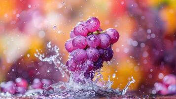 A cluster of grapes splashes into water, creating a vibrant and refreshing scene. photo