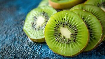 Slices of fresh kiwi arranged on a textured surface, showcasing vibrant colors and patterns. photo
