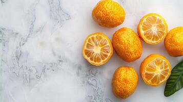 Fresh, vibrant citrus fruits arranged on a marble surface, showcasing their juicy interiors. photo