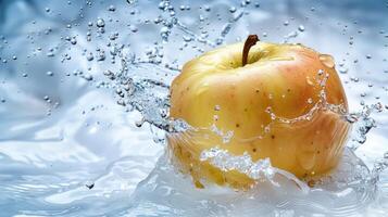 An apple splashes into water, creating dynamic droplets and a refreshing scene. photo