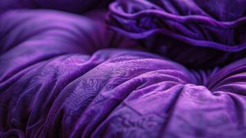 A close-up of a rich purple fabric, showcasing texture and intricate patterns. photo