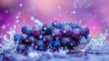 A cluster of grapes splashing in water with a colorful, blurred background. photo