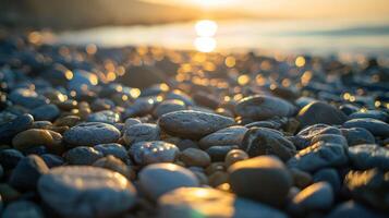 A close-up view of smooth pebbles on a beach during sunset, creating a tranquil atmosphere. photo