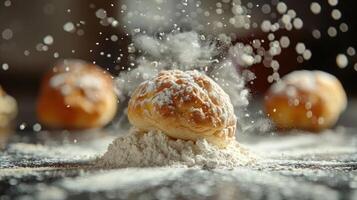 A freshly baked pastry sits atop a mound of flour, with flour particles floating in the air. photo