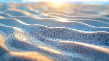 Soft, undulating sand dunes illuminated by sunlight create a serene beach atmosphere. photo
