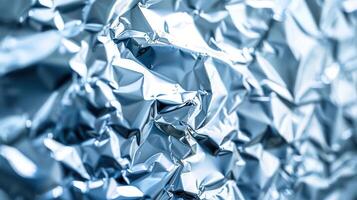 Close-up of crumpled aluminum foil, showcasing its shiny texture and reflective properties. photo