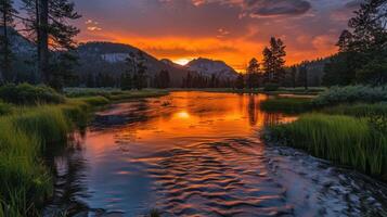 A serene landscape featuring a river reflecting a vibrant sunset amidst mountains and trees. photo