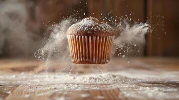 A floating cupcake surrounded by a cloud of flour, showcasing a playful baking scene. photo