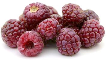 A cluster of fresh red raspberries on a white background. photo